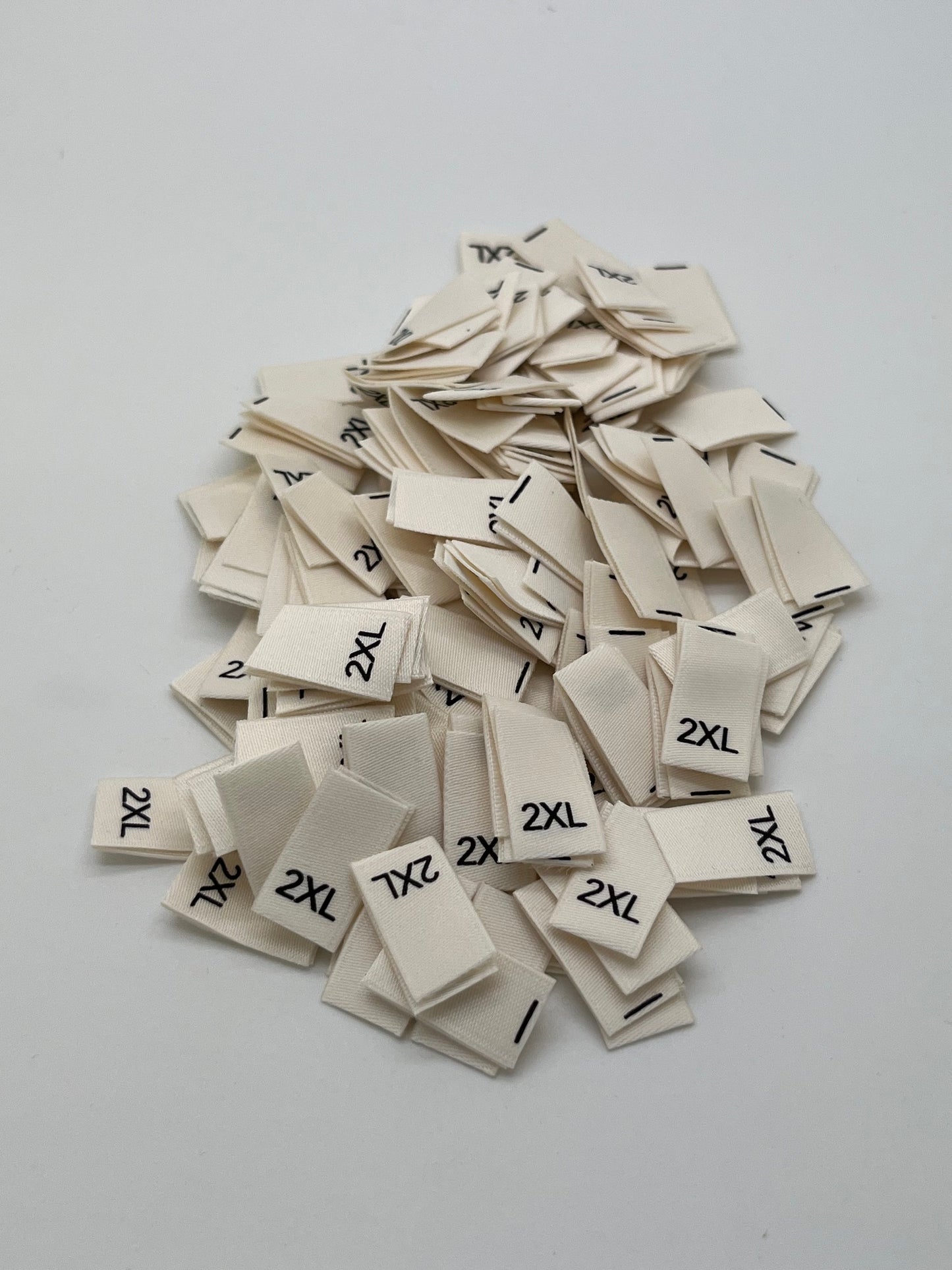 Cream size Labels Black text (XS – 2XL)