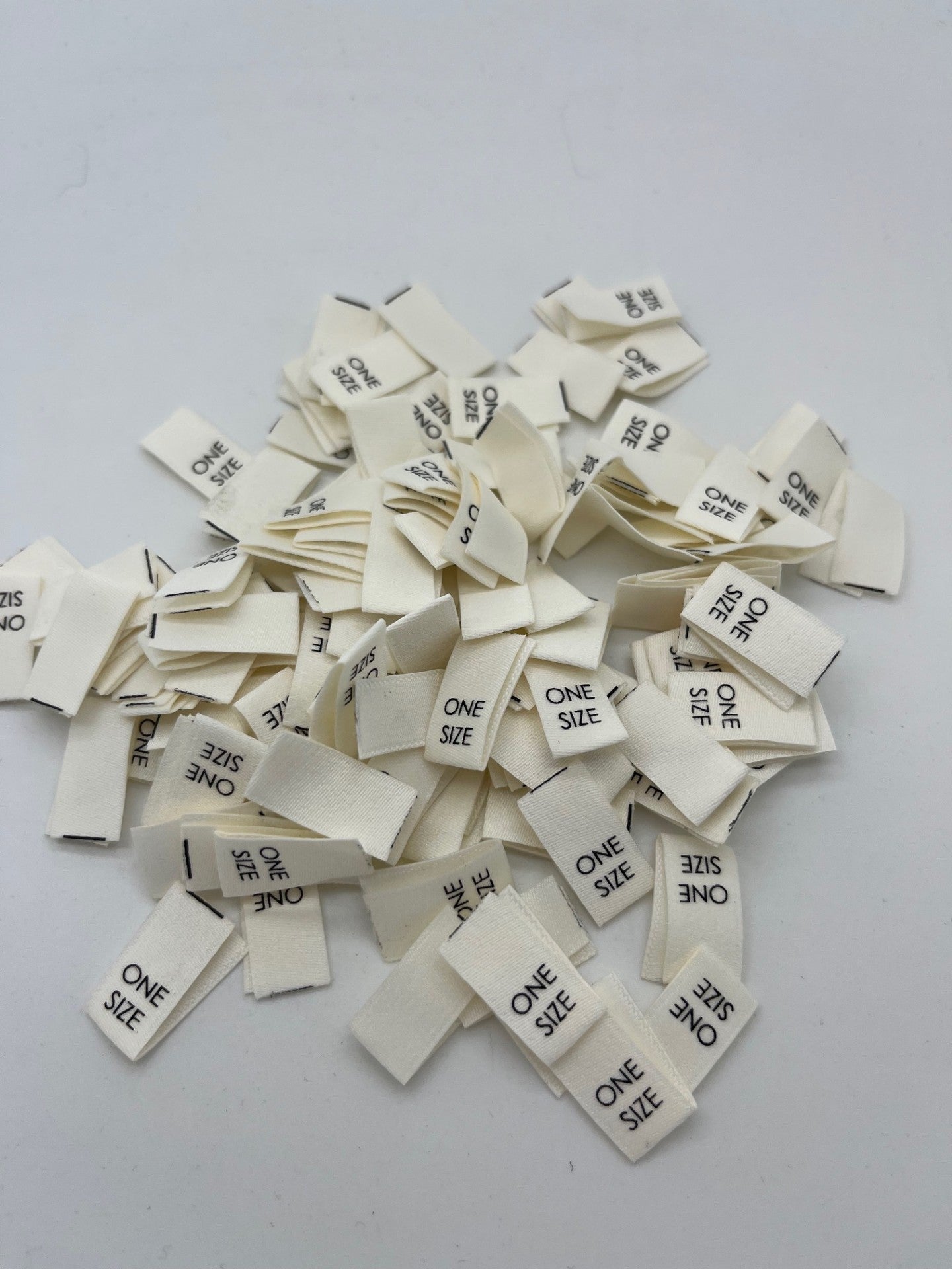 Cream size Labels Black text (XS – 2XL)